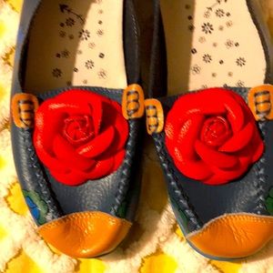 Vegan slip on shoe with red flower accents